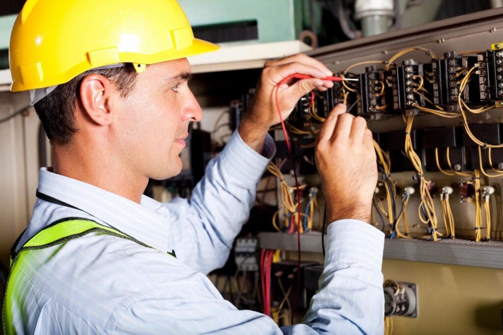 Professional electrician performing wiring repairs in Dousman, WI